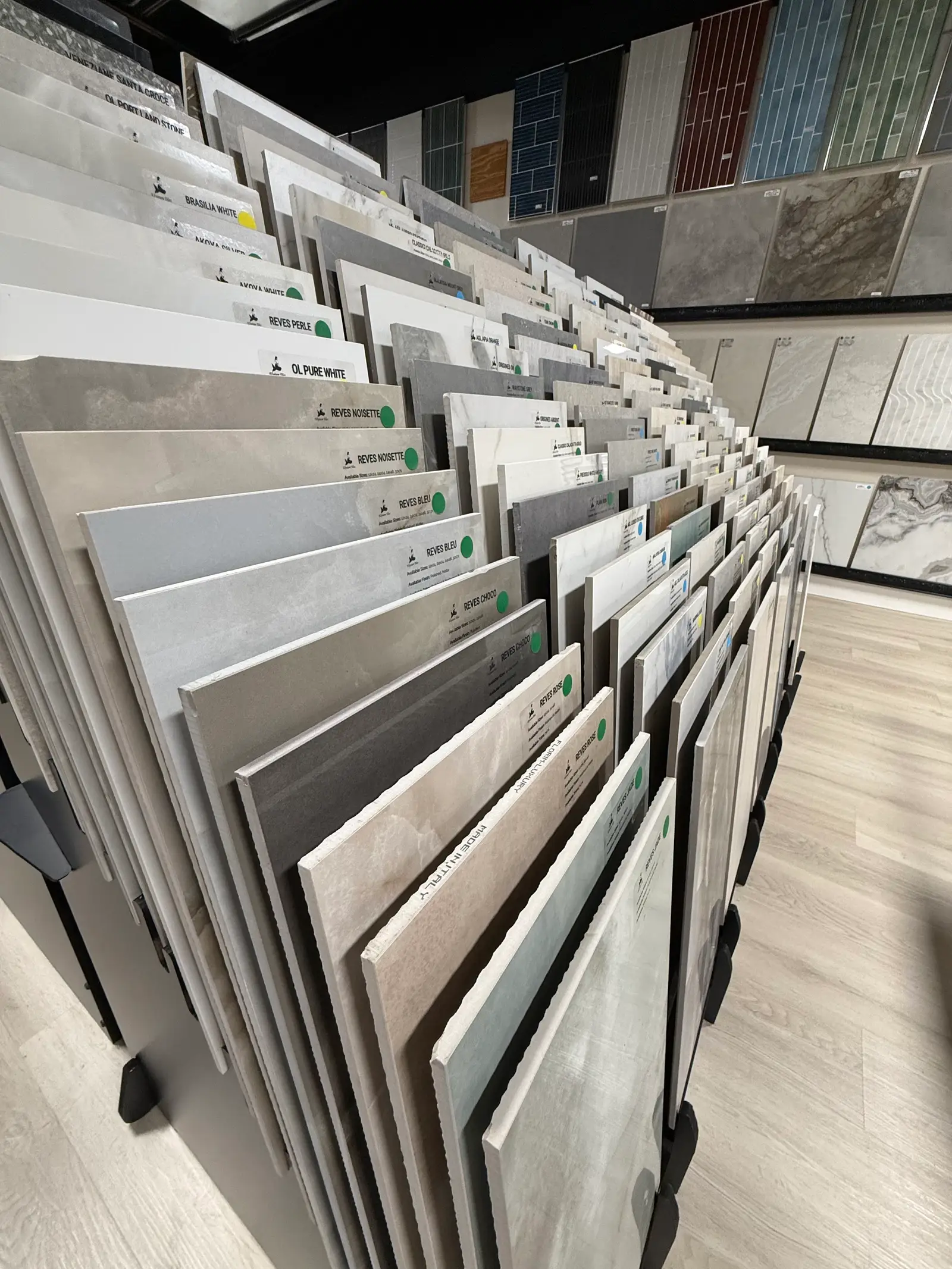 Plank tile and LVP samples fanned on a display