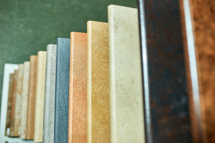 A display of rectangular kitchen countertops samples in various colors and textures, arranged in a diagonal row to help you choose countertop edge profiles with ease.