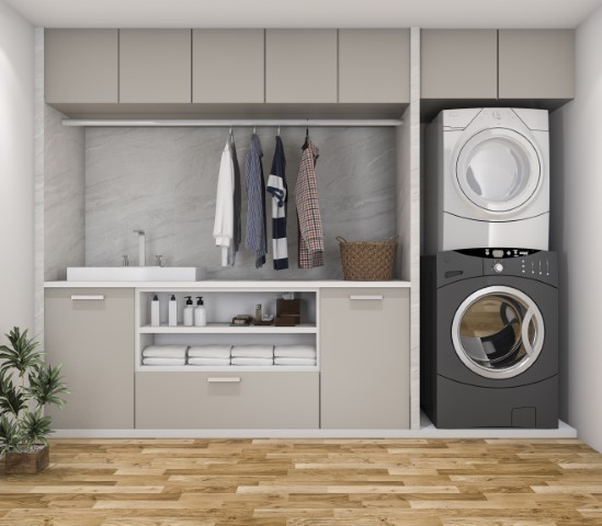 Modern laundry room with stacked washer and dryer, functional design, laundry room cabinets, sink, shelves with towels and toiletries, hanging clothes, and a potted plant on a wooden floor to elevate your space.