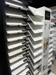 Display rack with samples of quartz countertops in various patterns and colors.